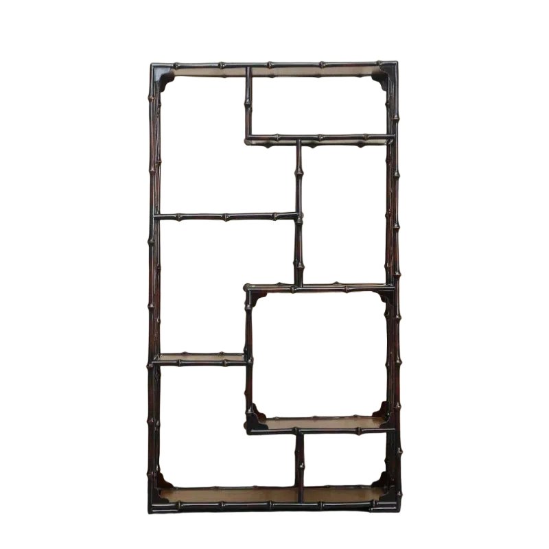 A decorative wall shelf resembling a bamboo-like design with multiple rectangular and square compartments. The structure is dark brown with a minimalist, open framework.